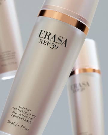 The Erasa Skincare XEP 30 Serum presented in a blush pink with soft metallic accents in a pump bottle.  Is is 50 mL and the bottom print of the bottle says "Extreme Line Lifting And Rejuvenation Concentrate"