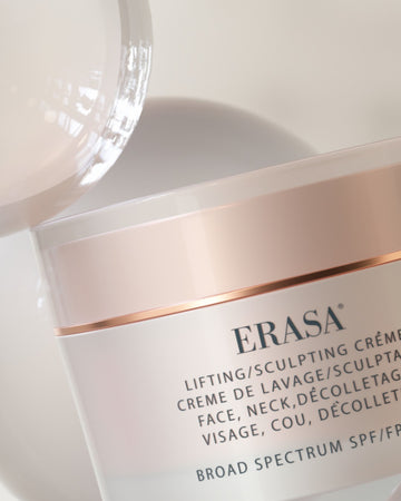 Blush pink metallic jar of Erasa SPF-30 Lifting/Sculpting Crème, elegant and stylish skincare packaging for a luxurious beauty experience.