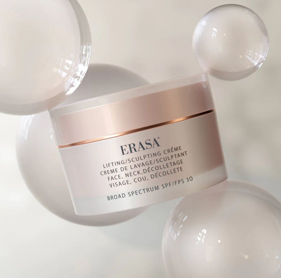 The Erasa SPF-30 Lifting/Sculpting Créme, the packaging is a blush and soft metallic pink. The print on the front says "Erasa: Lifting/Sculpting Créme- Face, Neck" it also says the same print in French.